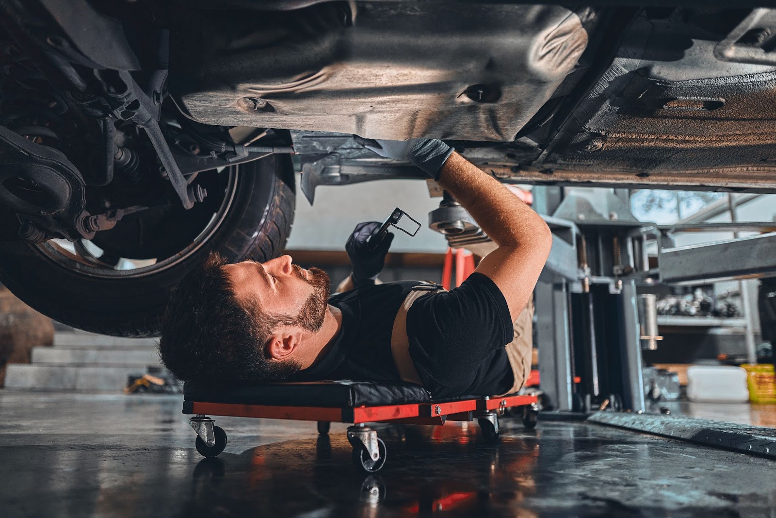 A man looking at the damage before selling a damaged car.